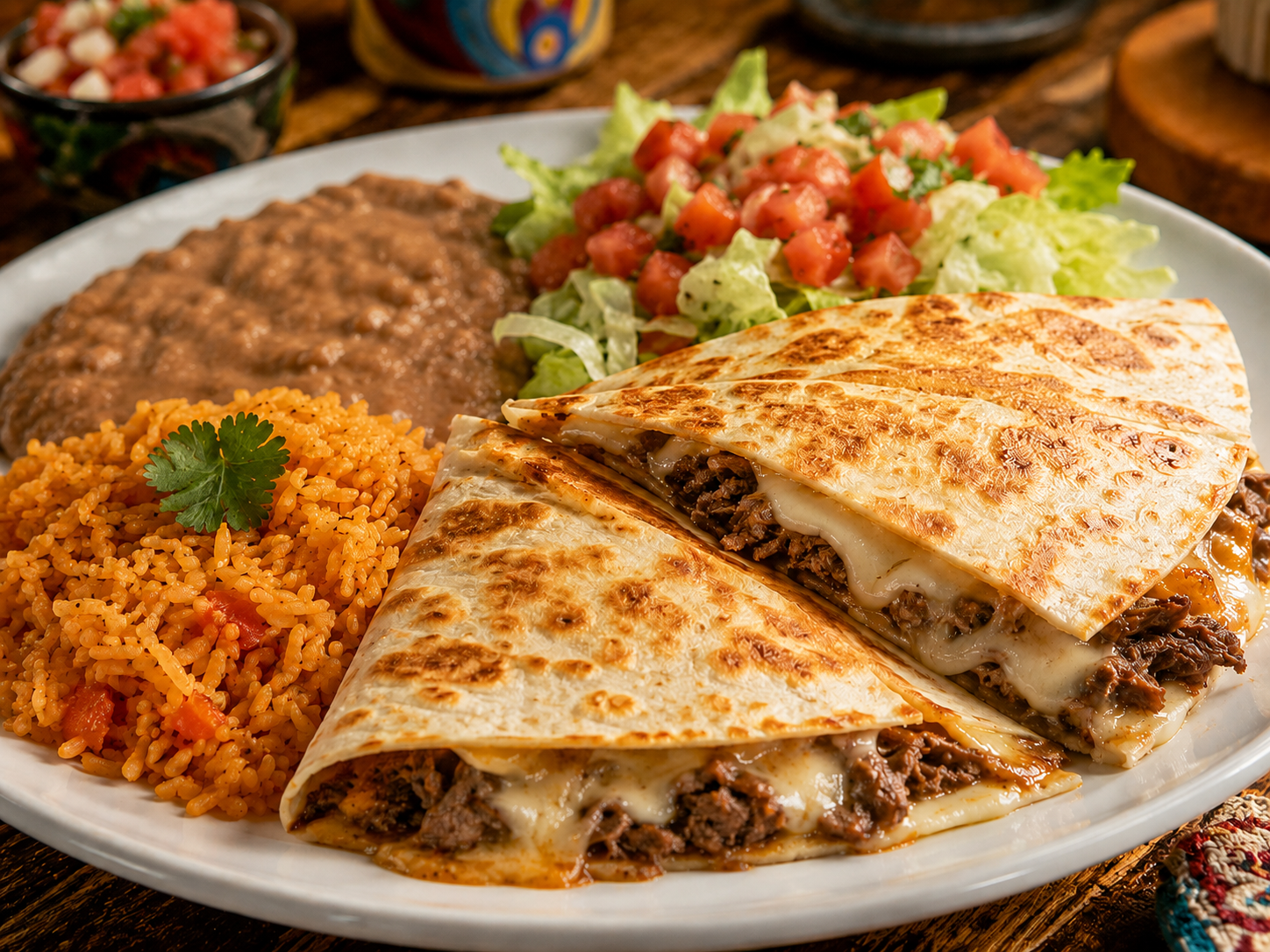 Big quesadilla plate served with rice, beans, and salad on a white plate