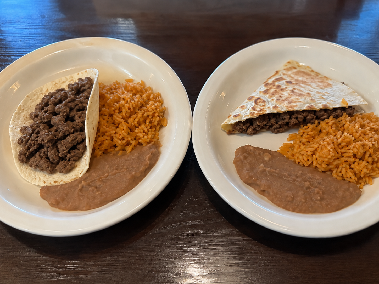 One Taco or Quesadilla served with rice and beans.
