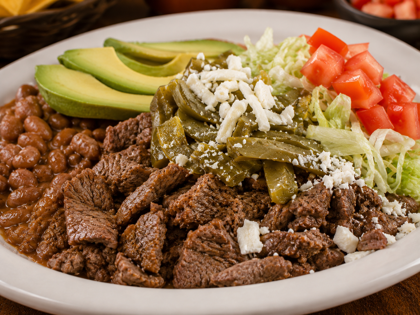 Special Plate served with guacamole, rice, beans, pico de gallo, and salad on a white plate
